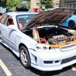 car with hood open, engine exposed